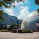 Hong Kong Museum of Art exterior with modern architecture featuring a white spherical dome structure and rectangular building